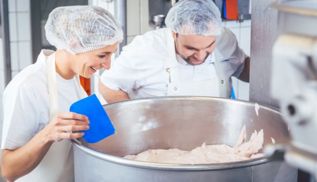 two-bakers-looking-at-dough